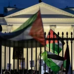 Pro-Palestinian protesters seen shaking White House gate vandalized with red paint: 'F--k Joe Biden'