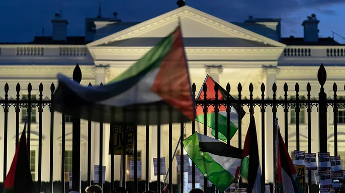 Pro-Palestinian protesters seen shaking White House gate vandalized with red paint: 'F--k Joe Biden'